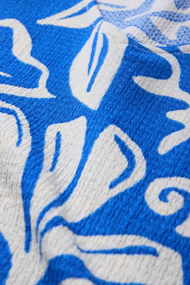 Dámské - Tričko s výstřihem ve tvaru V - regular fit - se vzorem - modrá/bílá