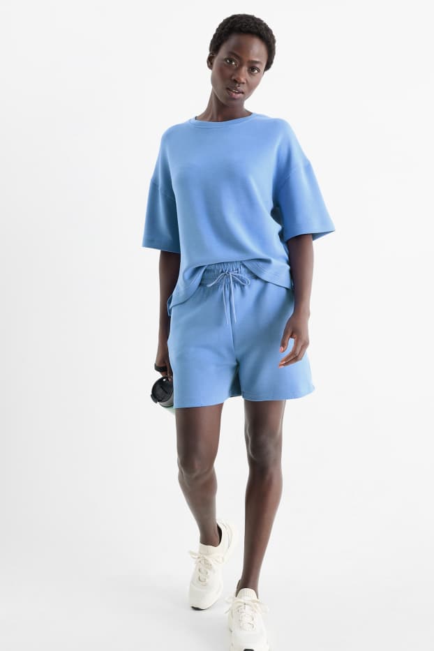 Dona - Pantalons curts tècnics - blau clar