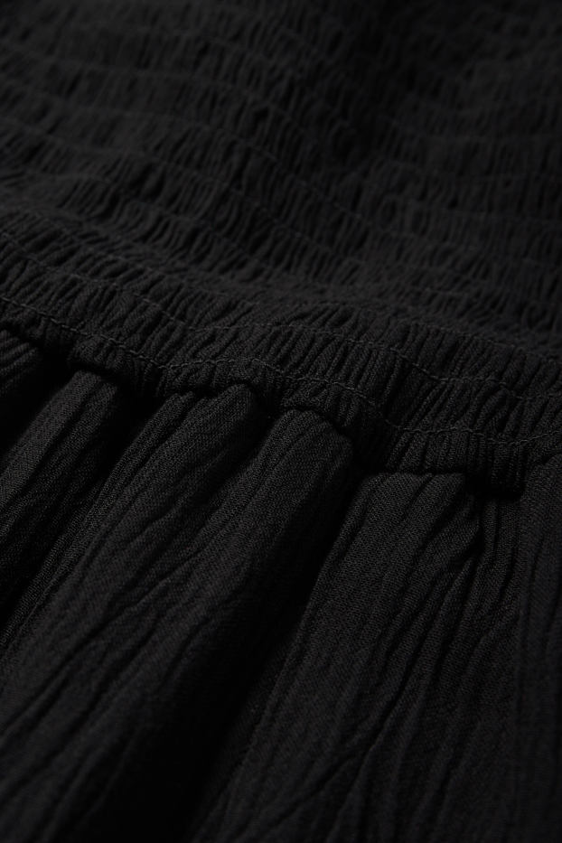 Femmes - Robe de coupe évasée - smockée - noir