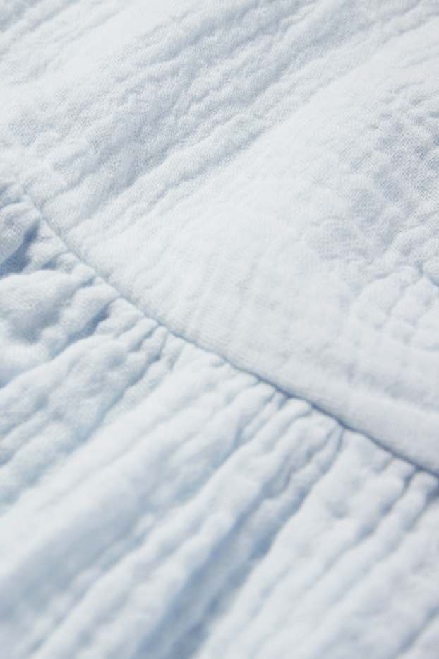 Dona - Brusa top de mussolina - blau clar
