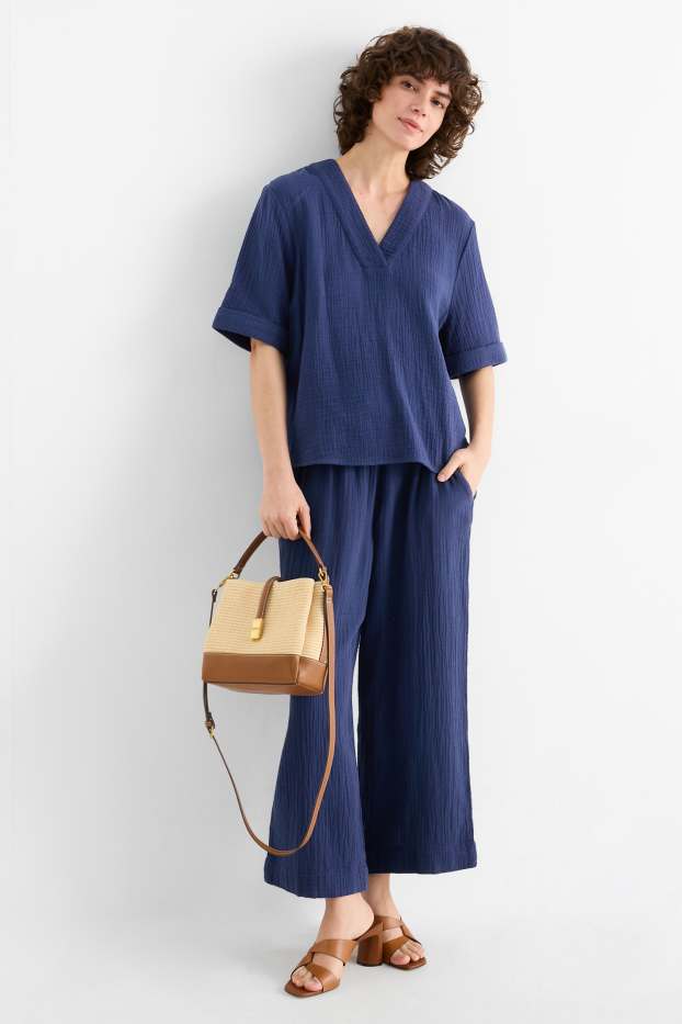 Kobiety - Spodnie materiałowe - wysoki stan - szerokie nogawki - ciemnoniebieski