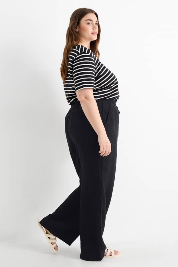 Dona - Pantalons de tela - mid waist - comfort fit - texturats - negre