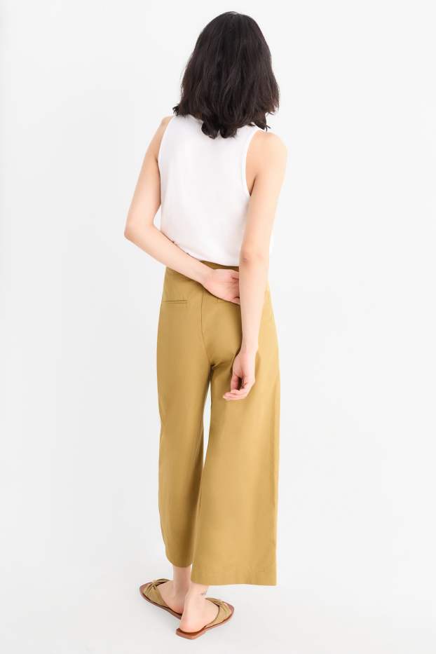 Dona - Pantalons de tela - high waist - wide leg - groc mostassa