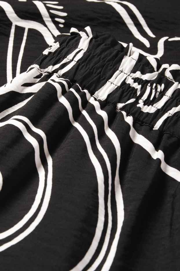 Femei - Pantaloni de stofă - talie medie - loose fit - cu model - negru / alb