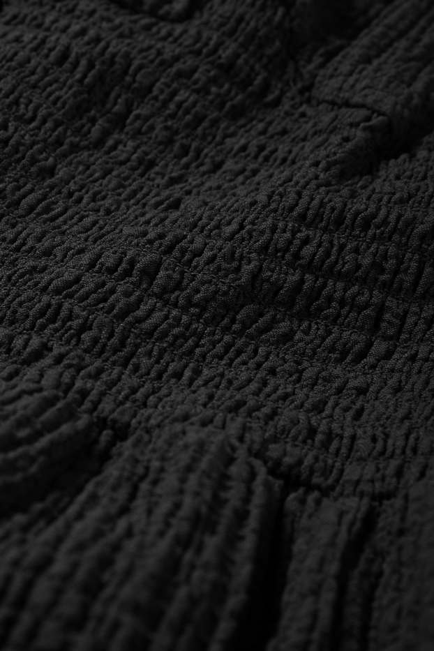 Damen - Jumpsuit - gesmokt - strukturiert - schwarz