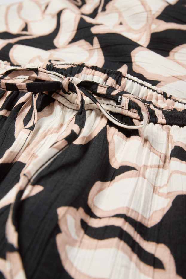 Femmes - Pantalon en toile - mid waist - palazzo - à fleurs - noir / beige