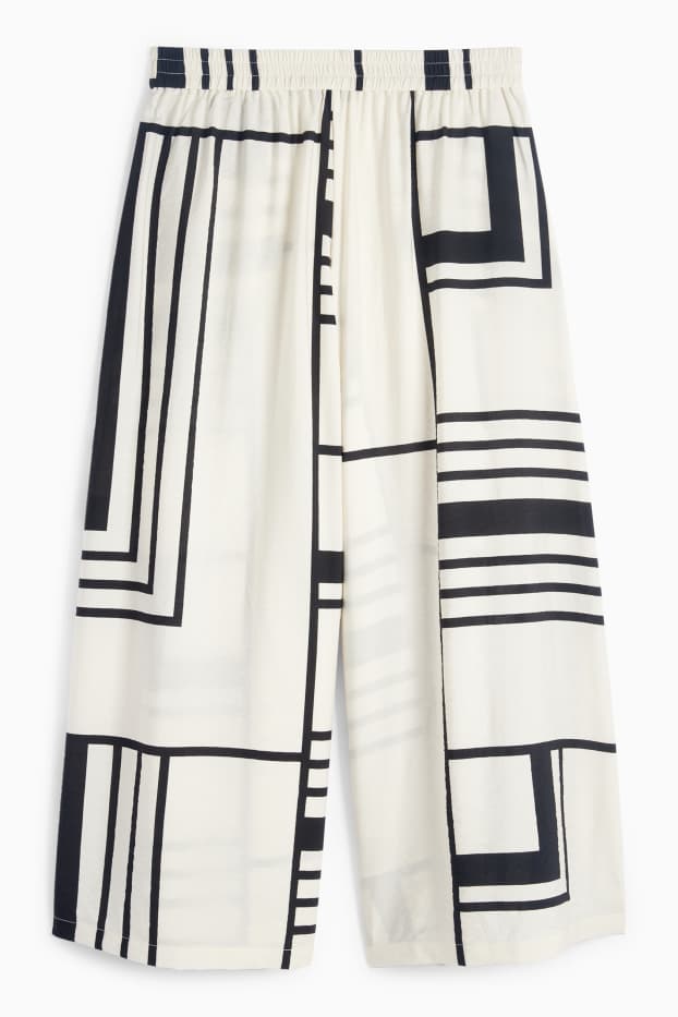 Women - Cloth trousers - high waist - wide leg - patterned - white / black