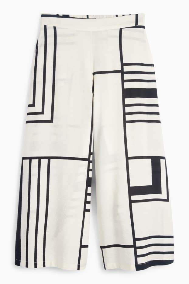 Women - Cloth trousers - high waist - wide leg - patterned - white / black