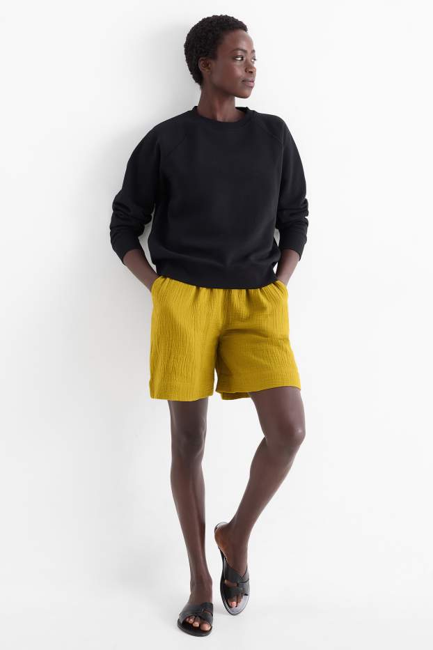 Dames - Korte broek van mousseline - high waist - mosterdgeel