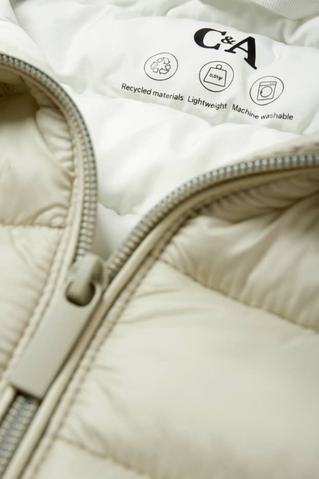 Dames - Lange bodywarmer met capuchon - licht beige