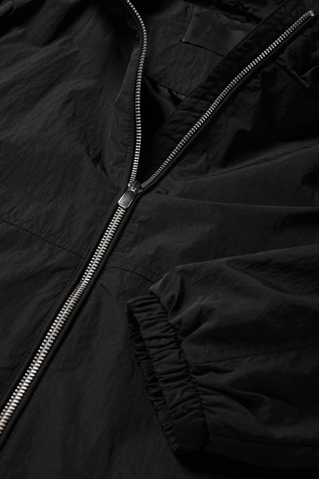 Damen - Jacke mit Kapuze - wasserabweisend - schwarz