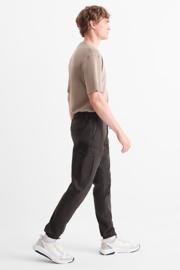 Uomo - Pantaloni cargo - tapered fit - nero