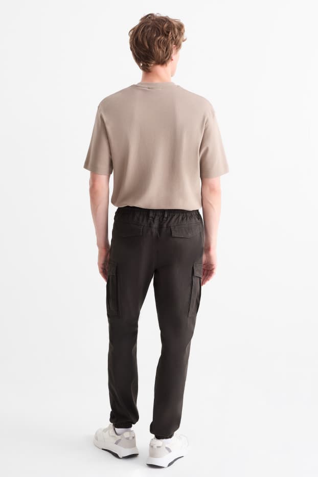 Uomo - Pantaloni cargo - tapered fit - nero