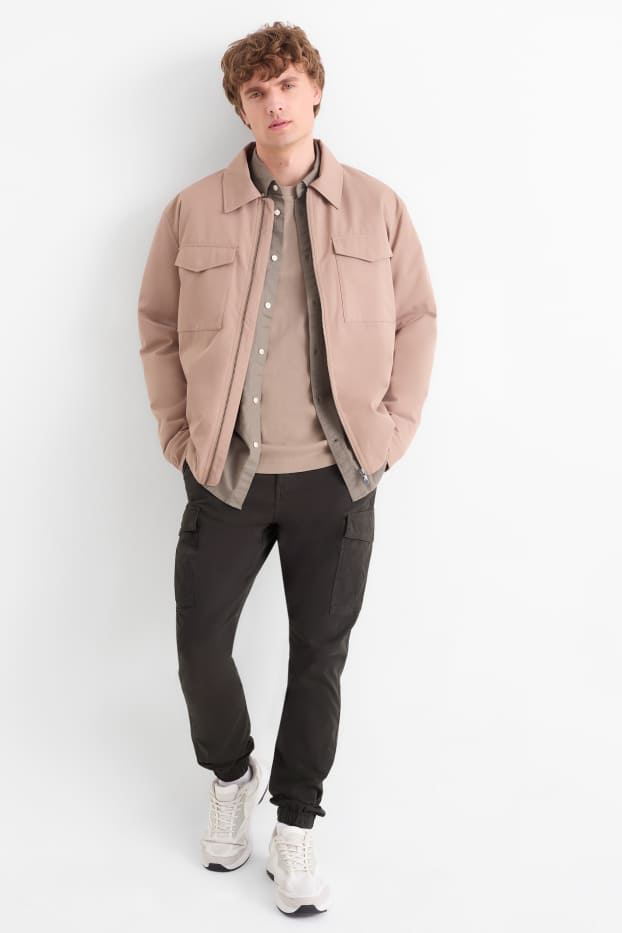 Uomo - Pantaloni cargo - tapered fit - nero