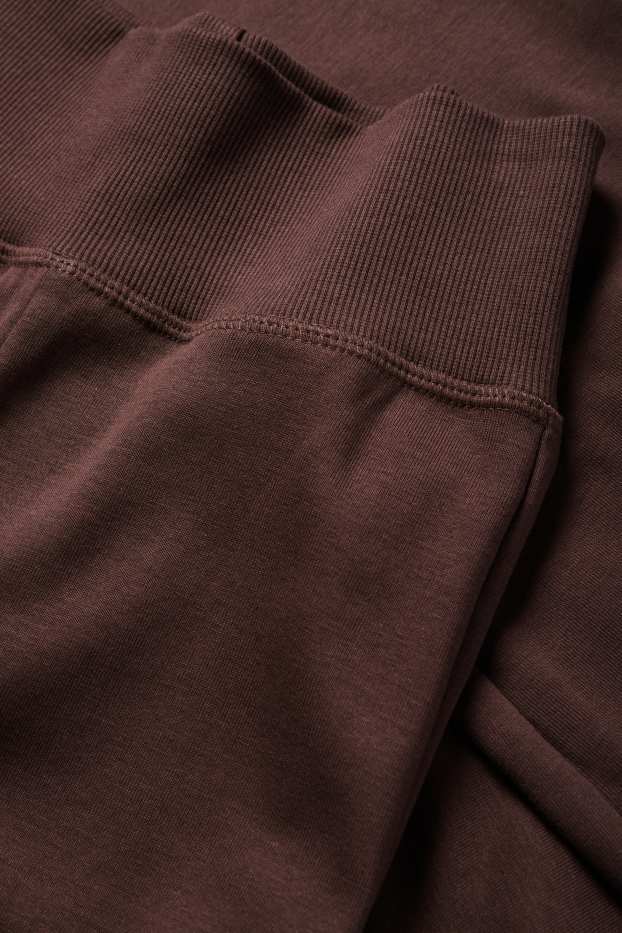 Dona - Leggings acampanats - marró fosc