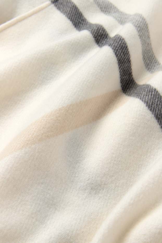 Dames - Poncho met franjes - geruit - crème wit