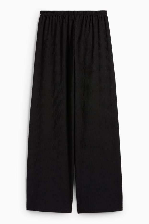 Dames - Broek van jersey - mid waist - wide leg - met structuur - zwart