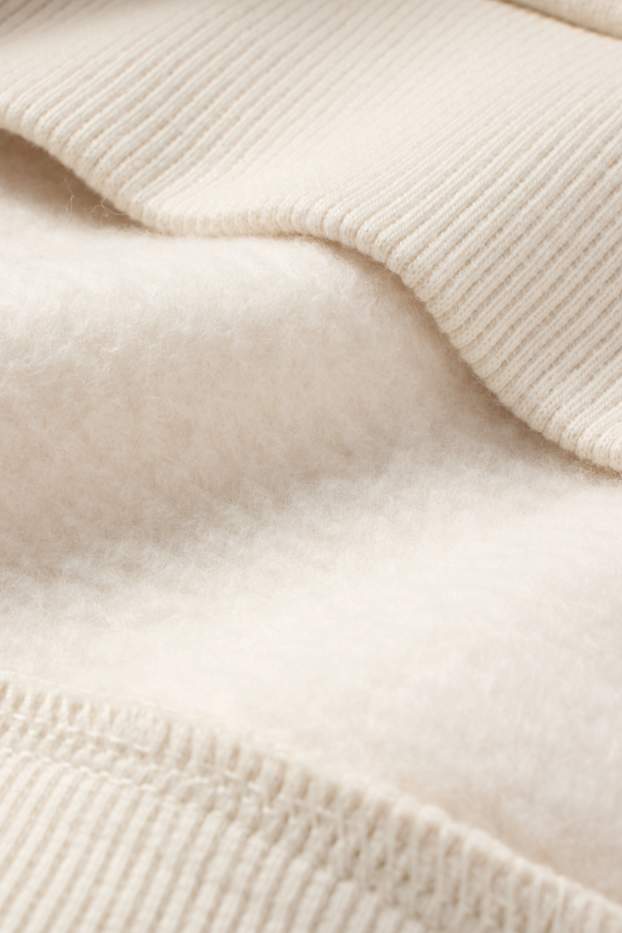 Nena - Osset de peluix - dessuadora amb caputxa - beix clar