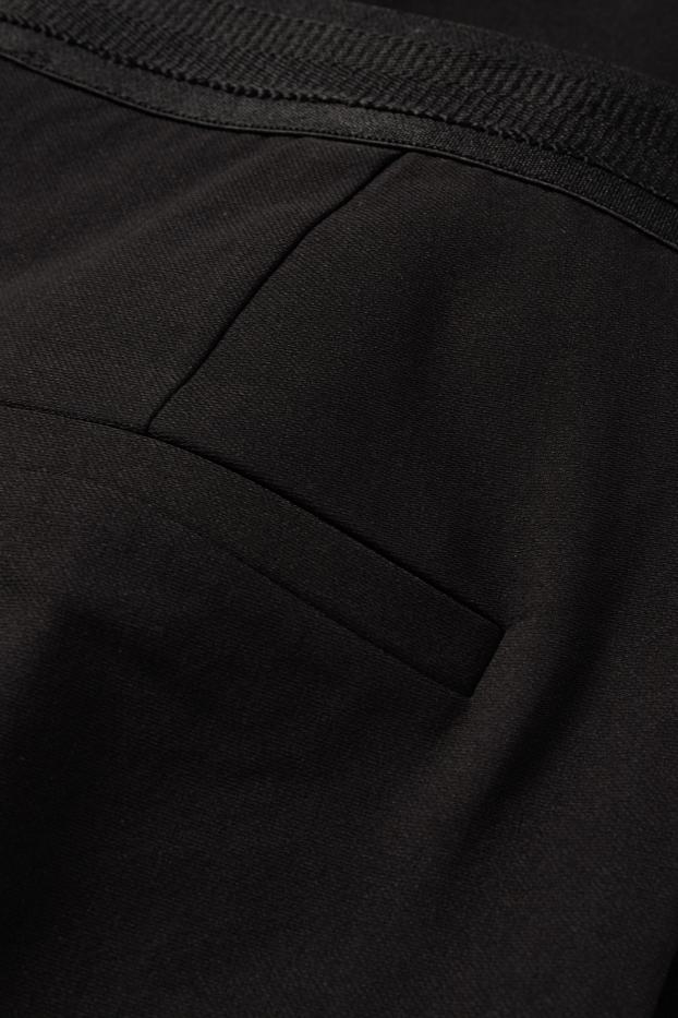 Kobiety - Spodnie materiałowe - średni stan - tapered fit - czarny
