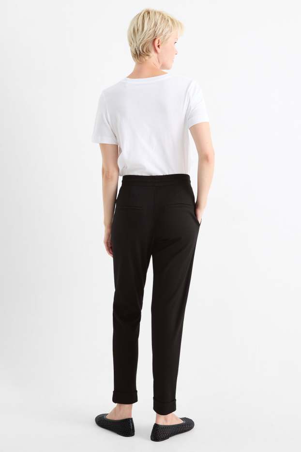 Dames - Broek van jersey - mid waist - tapered fit - zwart