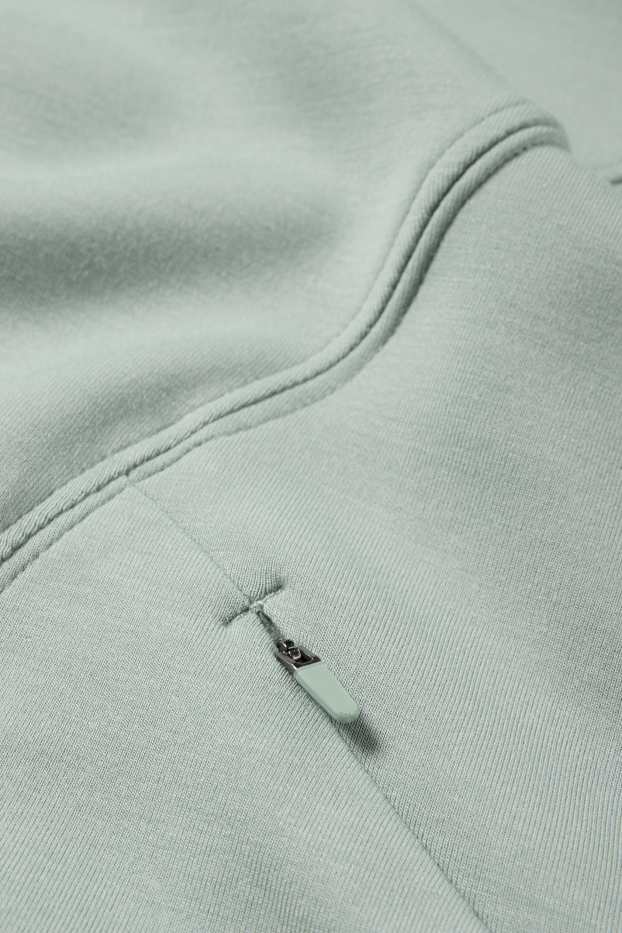 Kobiety - Sportowa bluza z kapturem - yoga - jasnozielony