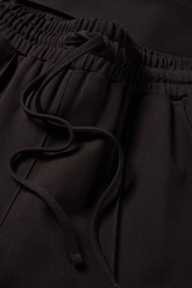Femei - Pantaloni din jerseu - talie medie - tapered fit - negru