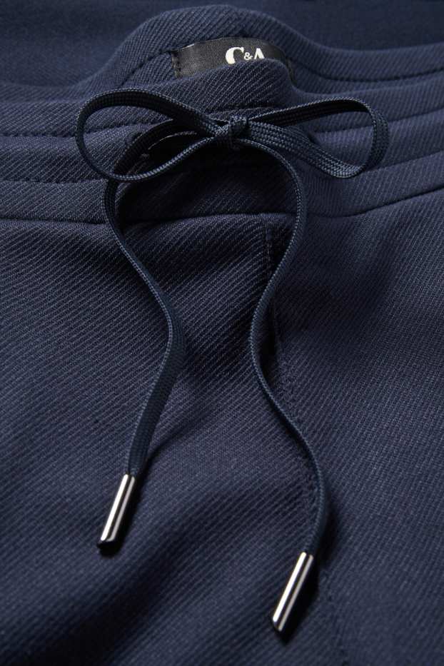 Dámské - Žerzejové kalhoty - mid waist - tapered fit - tmavomodrá