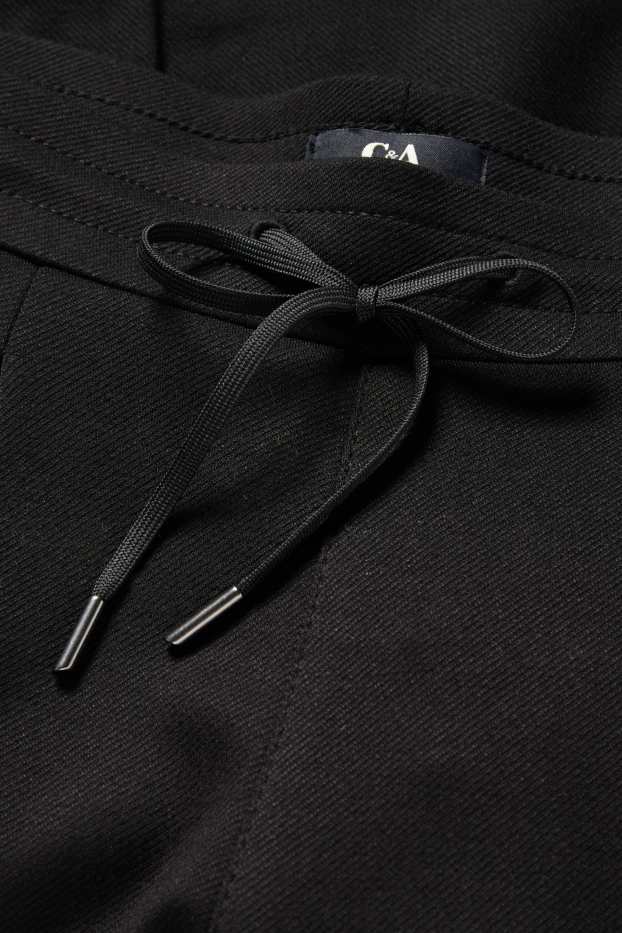 Dámské - Žerzejové kalhoty - mid waist - tapered fit - černá