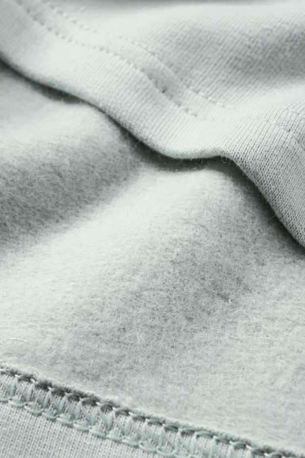 Miminka - chlapci - Dinosauři - pyžamo pro miminka - 2dílné - mátově zelená