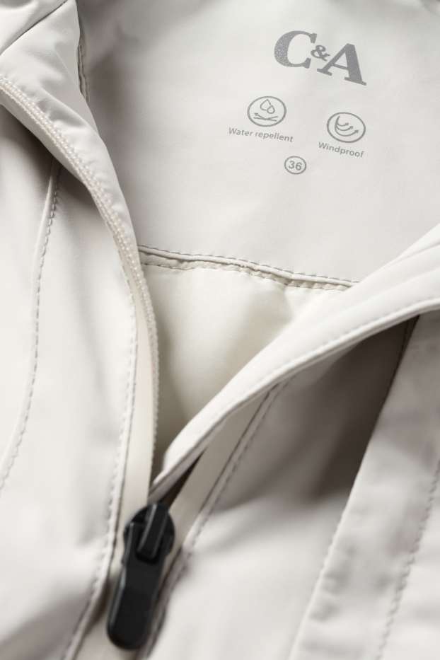 Dona - Jaqueta amb caputxa - folrada - impermeable - blanc neu