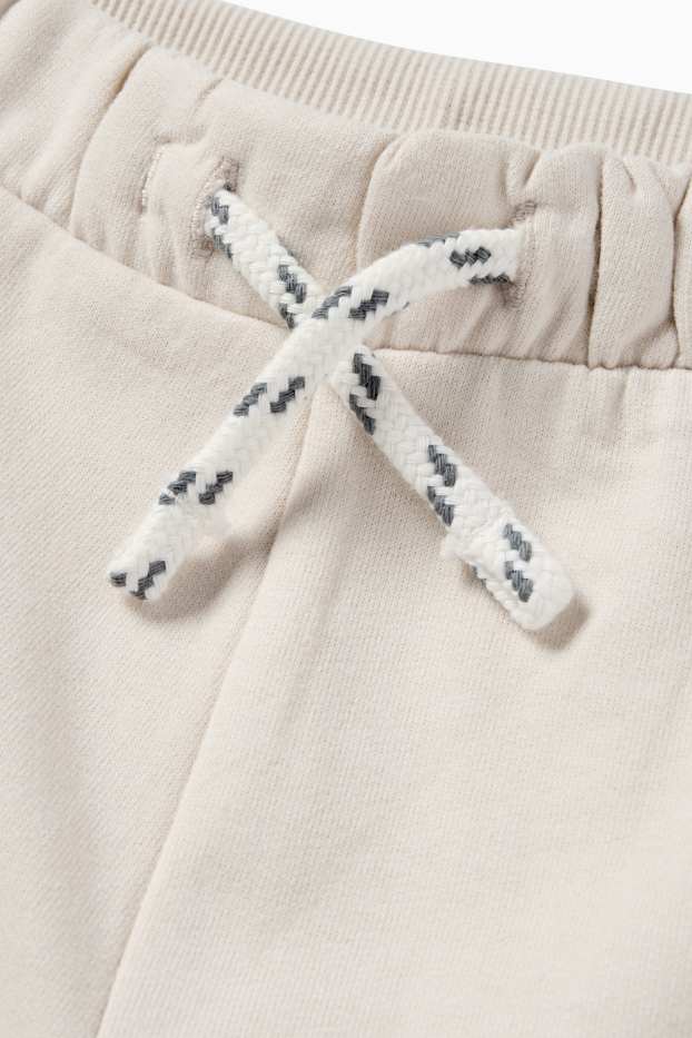 Miminka - chlapci - Cargo teplákové kalhoty pro miminka - světle béžová