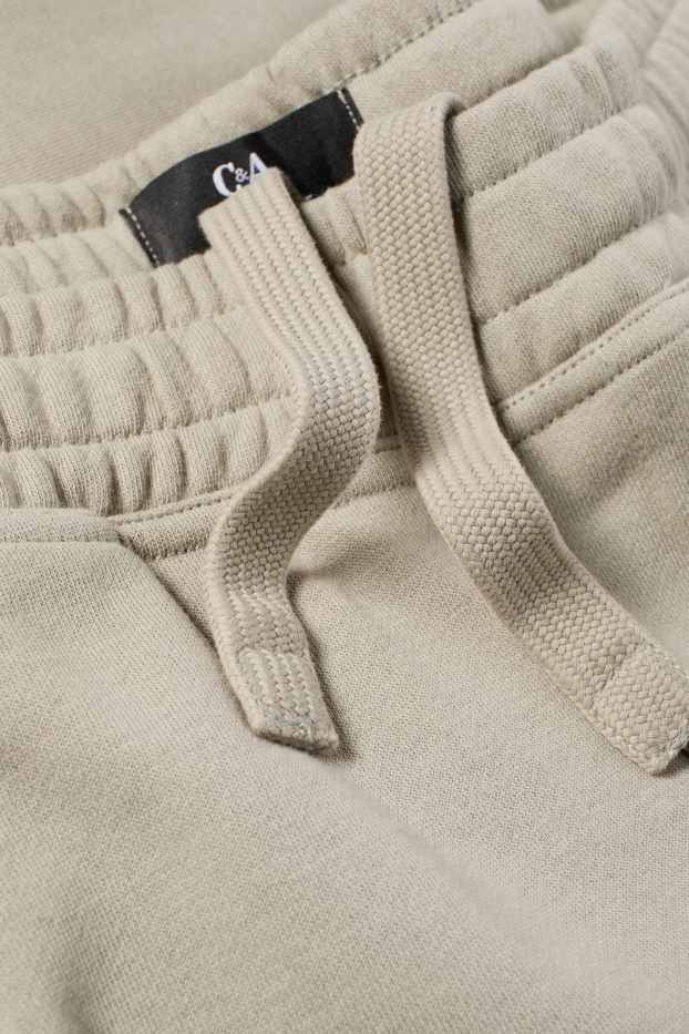 Uomo - Pantaloni sportivi - grigio chiaro