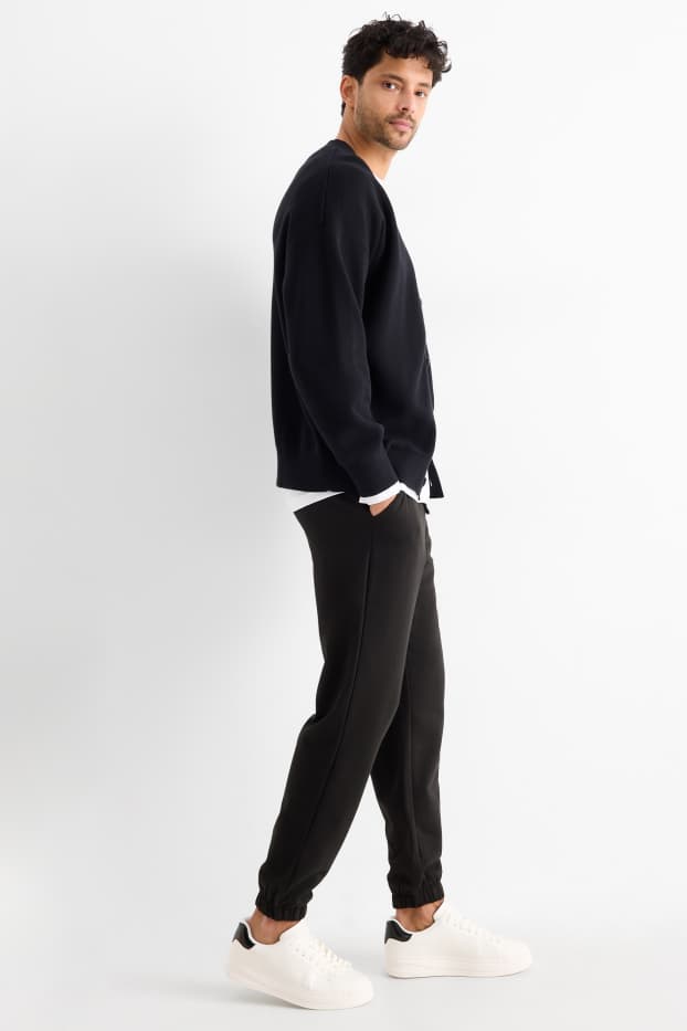 Uomo - Pantaloni sportivi - nero