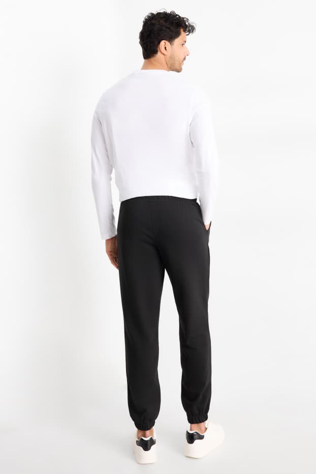 Uomo - Pantaloni sportivi - nero