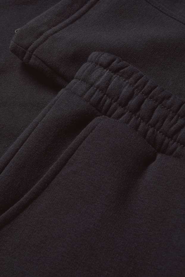 Pánské - Teplákové kalhoty - černá