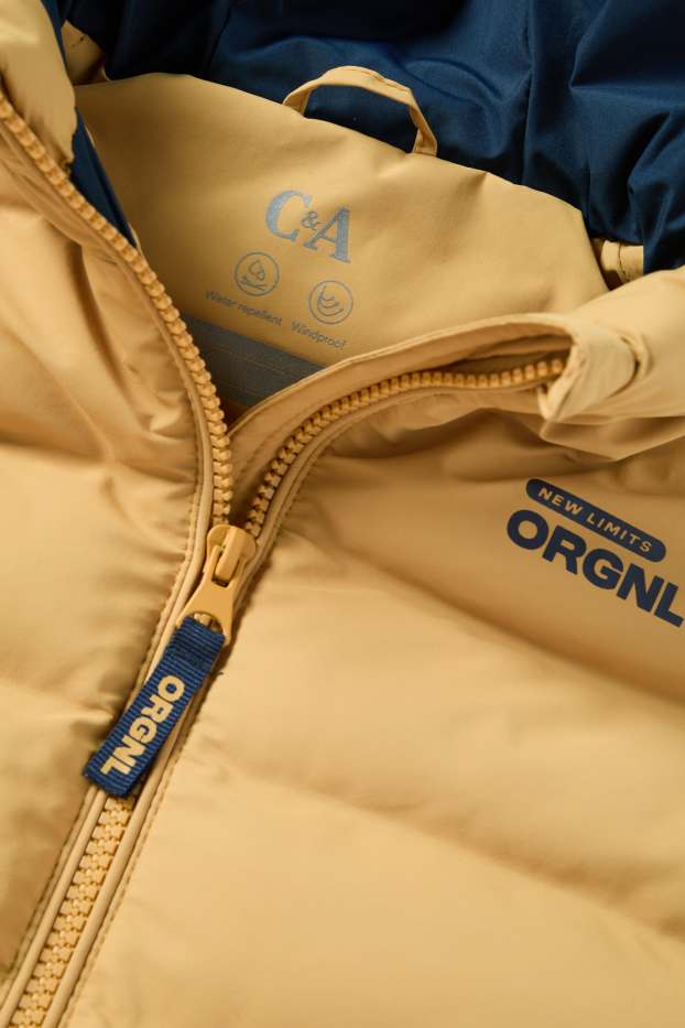 Nen - Armilla embuatada amb caputxa - repel·lent a l’aigua - taronja clar