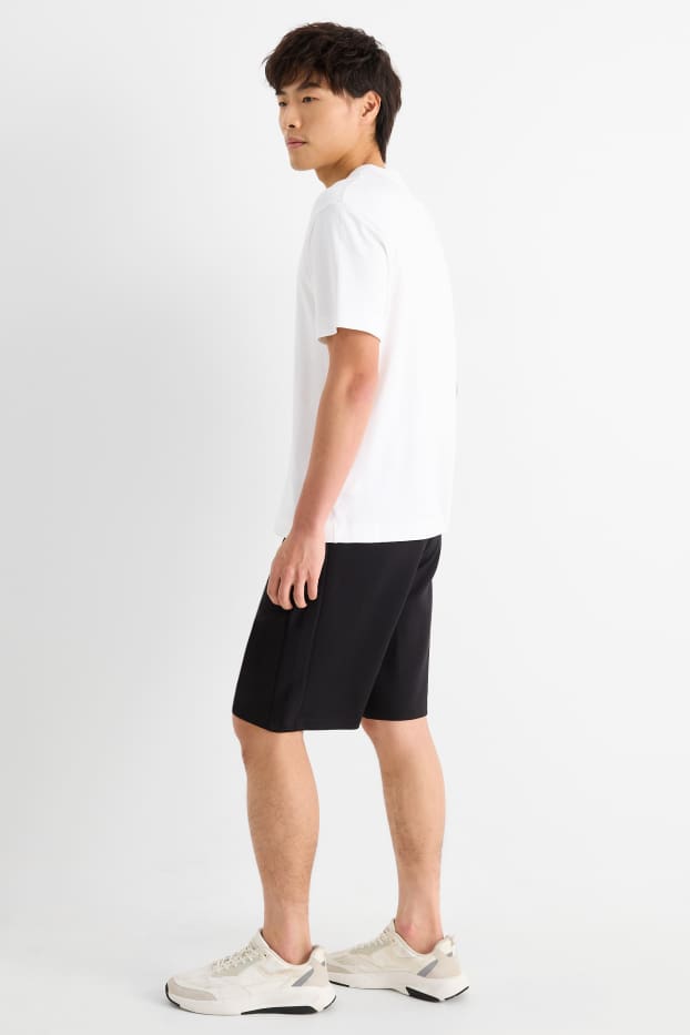 Uomo - Shorts in felpa - tessuto tramato - nero