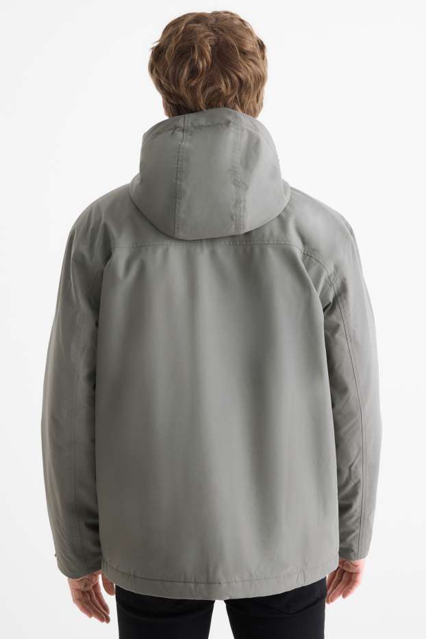 Home - Jaqueta per a la pluja amb caputxa -folrada - impermeable - verd