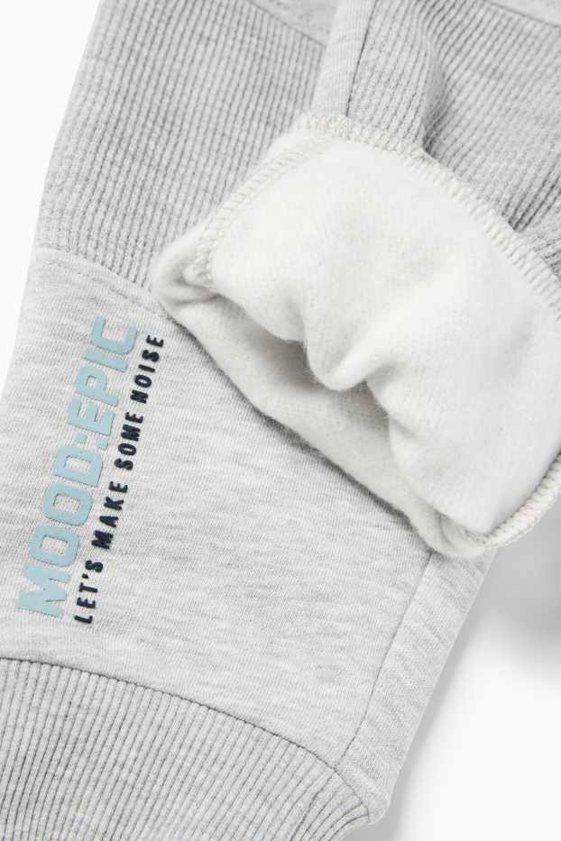 Děti - chlapci - Teplákové kalhoty - světle šedá-žíhaná