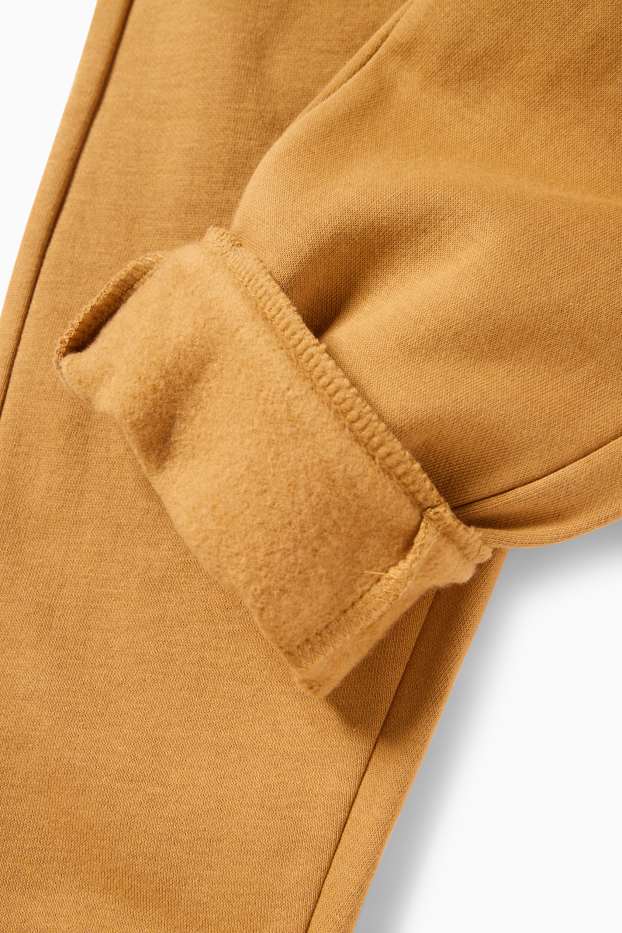 Děti - chlapci - Teplákové kalhoty - hnědá