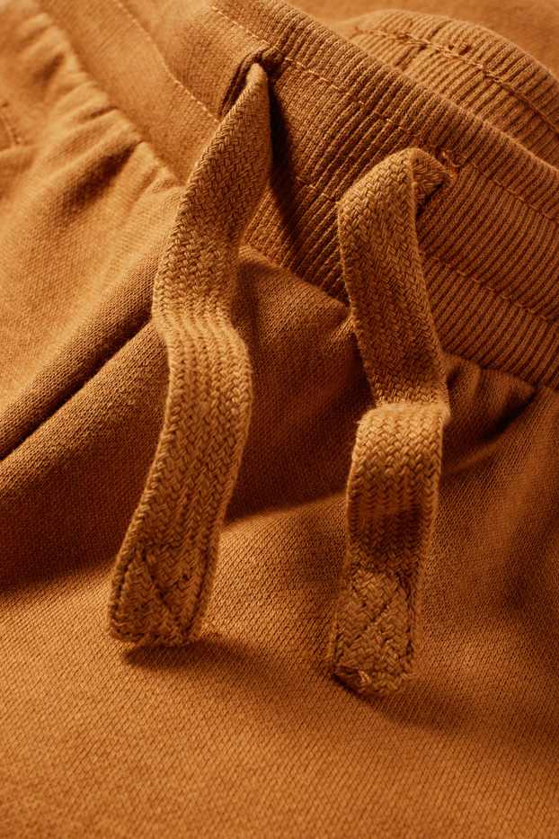 Děti - chlapci - Teplákové kalhoty - hnědá