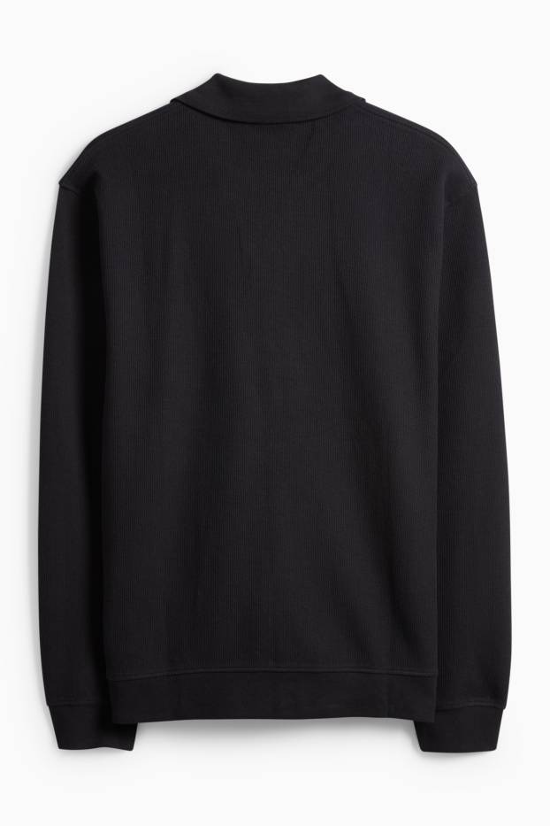 Hommes - Polo à manches longues - en maille - relaxed fit - finition côtelée - noir