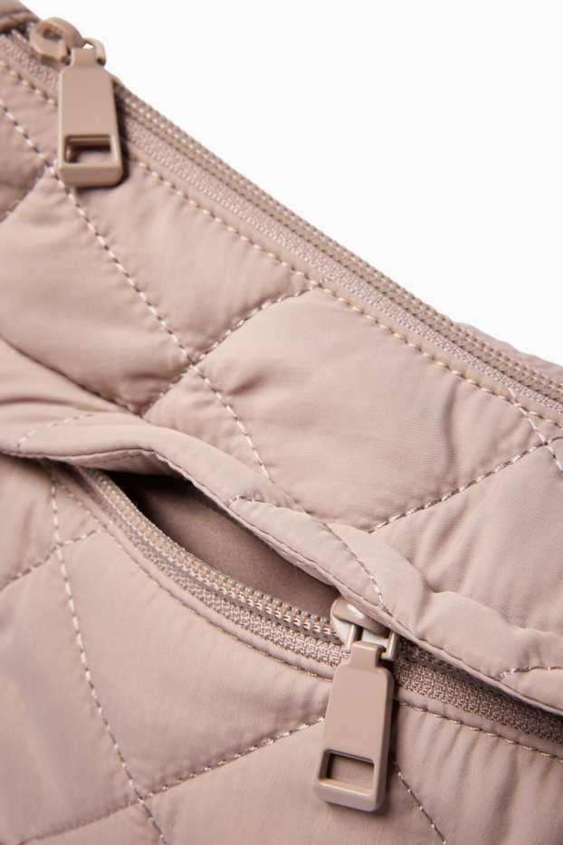 Dona - Bandolera enconxada - beix clar