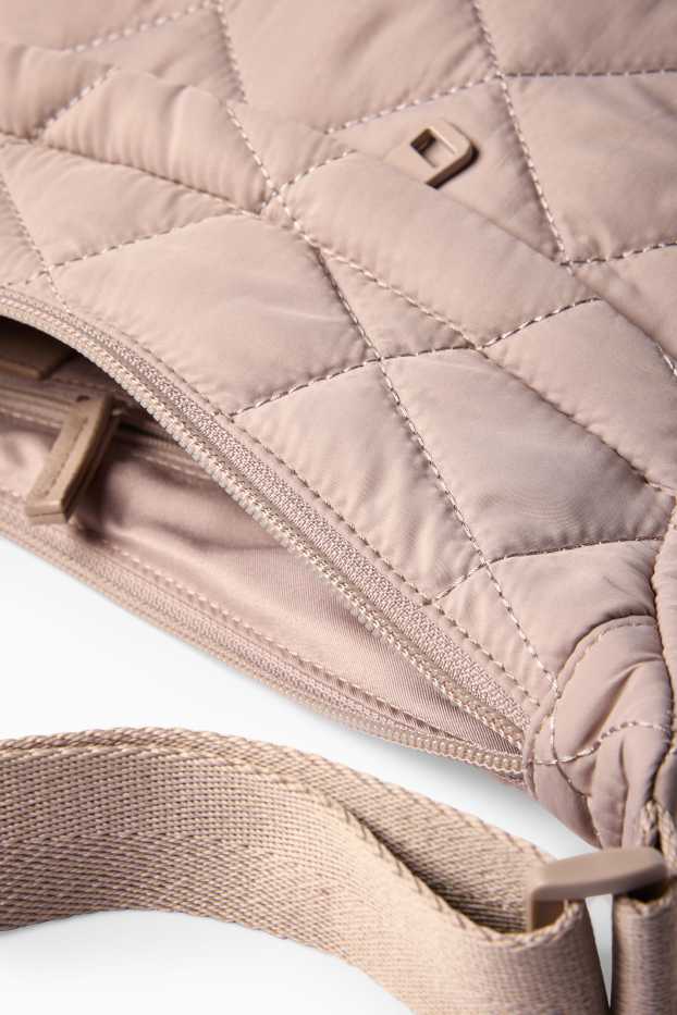 Dona - Bandolera enconxada - beix clar