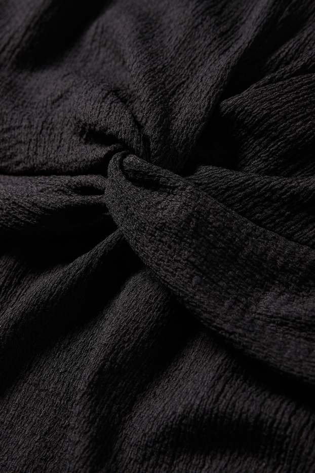 Femmes - Robe de grossesse - finition texturée - noir