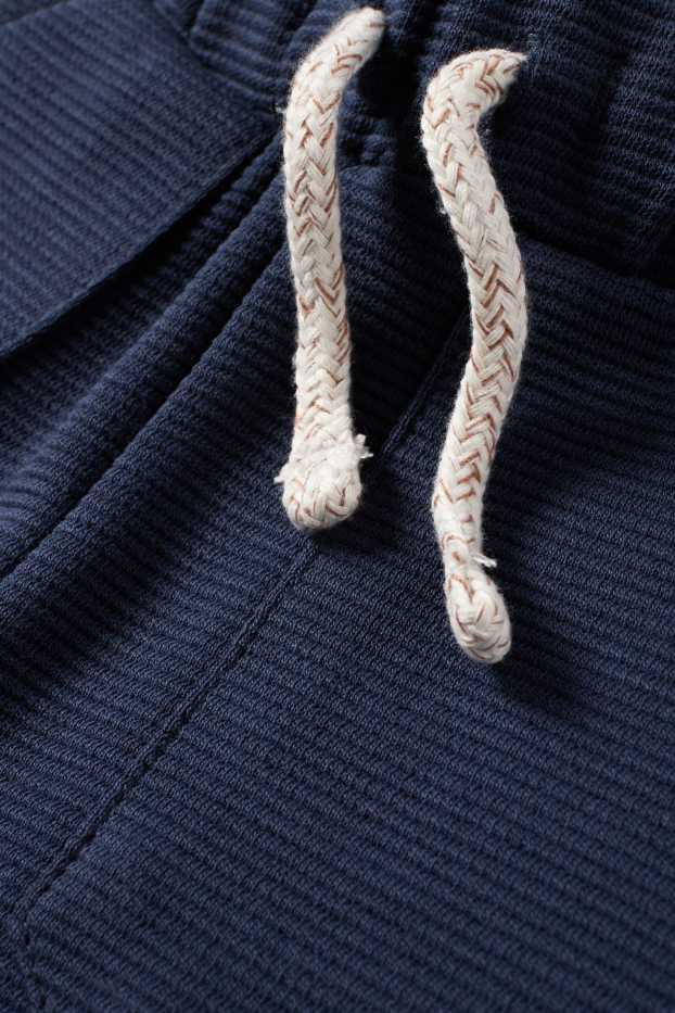 Miminka - chlapci - Teplákové šortky pro miminka - žebrované - tmavomodrá