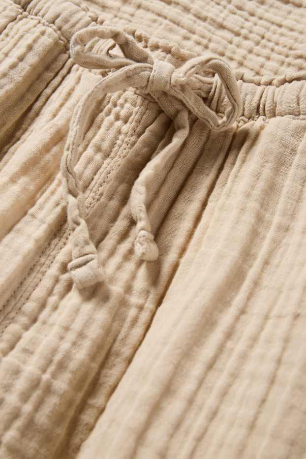 Dona - Pantalons de tela - mid waist - loose fit - beix