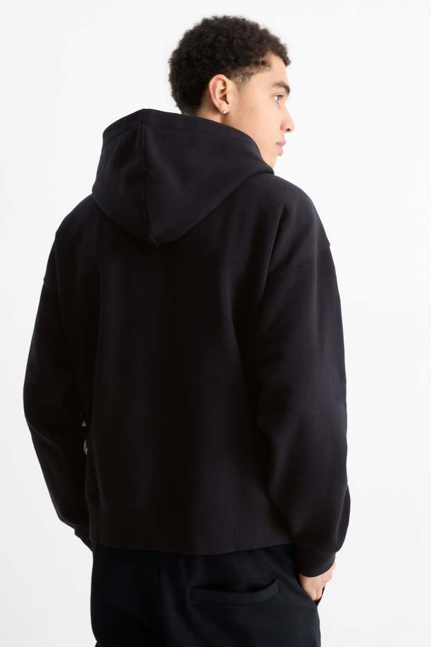 Home - Dessuadora oversized amb caputxa - negre