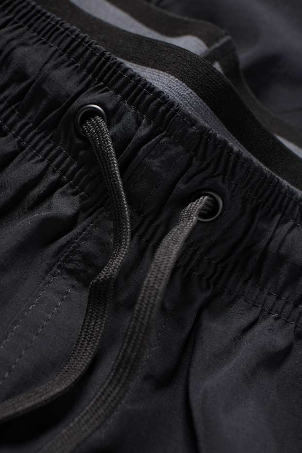 Home - Banyador - look 2 en 1 - negre