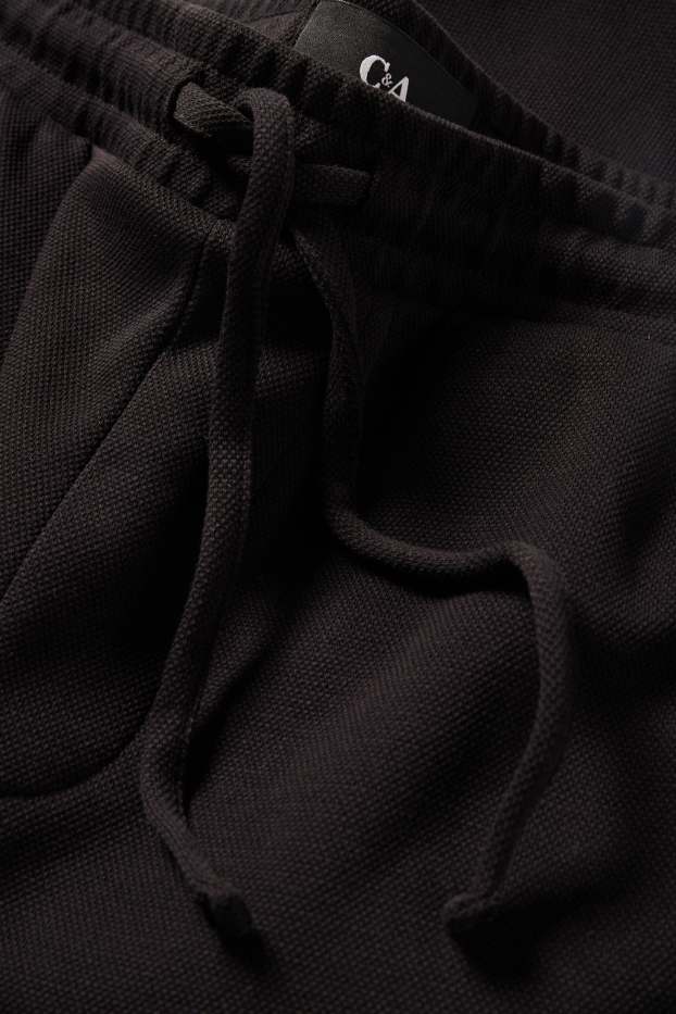 Uomo - Shorts di felpa - tessuto tramato - nero